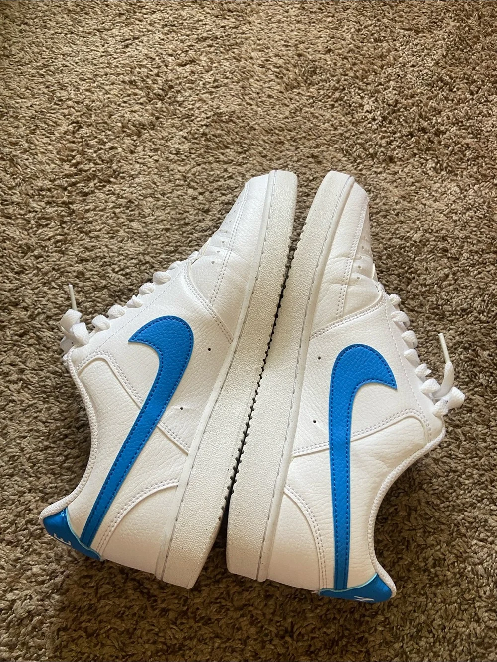 Nike White Low-Top Sneakers with Blue Swoosh
